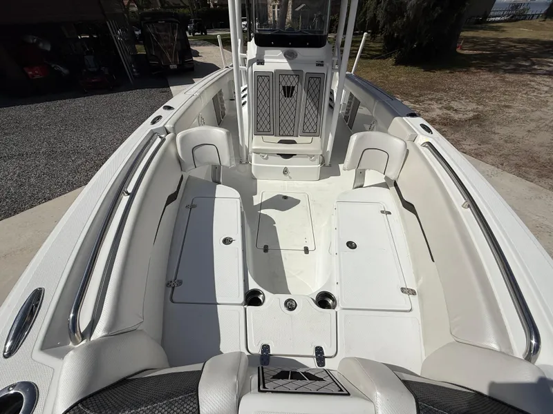 Slide: The Image of 2021 Wellcraft 242 Offshore boat interior with spacious seating and storage compartments. - 39