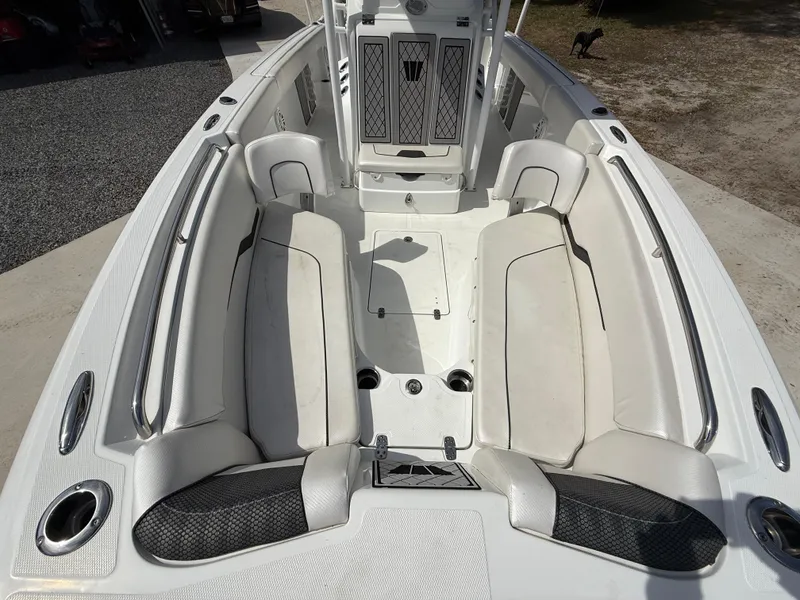 Slide: The Image of 2021 Wellcraft 242 Offshore boat interior with white seating and modern design. - 40
