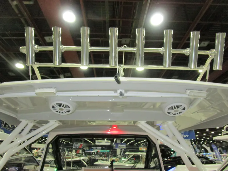 Slide: The Image of 2025 Solara S-310 CW boat with integrated Kenyon grill and storage compartment. - 12