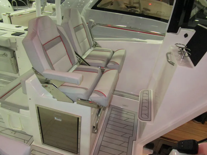 Slide: The Image of 2025 Solara S-310 CW boat interior with foldable seating and Yamaha engines. - 13