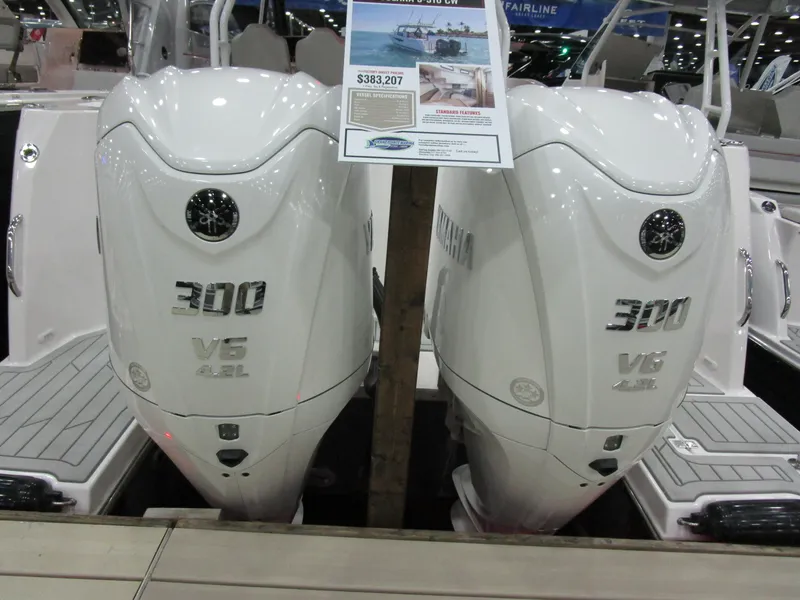 Slide: The Image of 2025 Solara S-310 CW boat on trailer, sleek design, parked outdoors. - 2