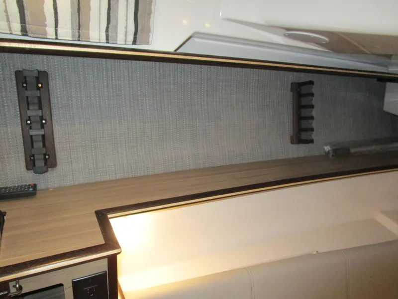 Slide: The Image of Luxury seating in 2025 Solara S-310 CW boat, featuring white upholstery with red accents. - 22