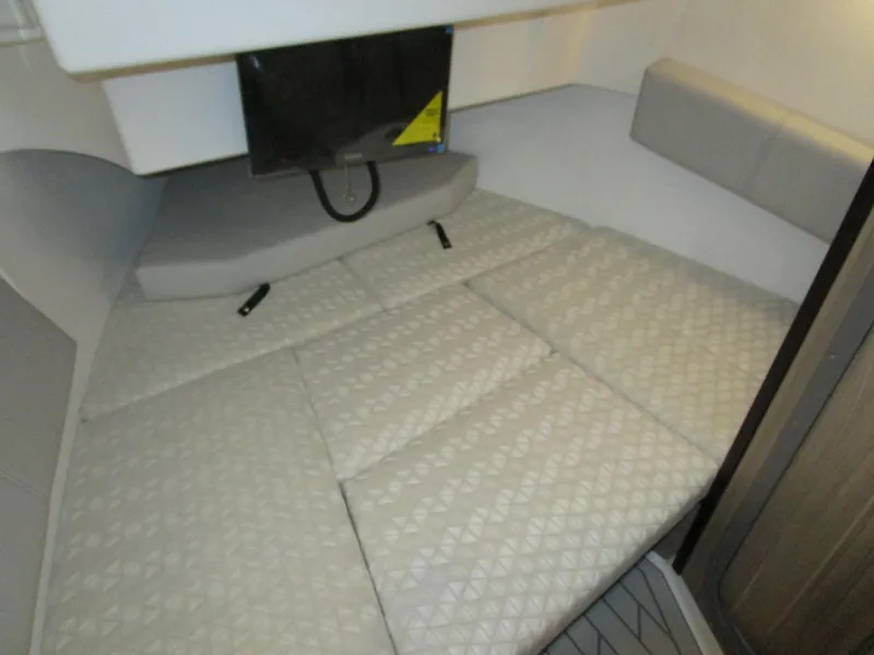 Slide: The Image of 2025 Solara S-310 CW boat interior at a showroom, featuring modern controls and seating. - 23