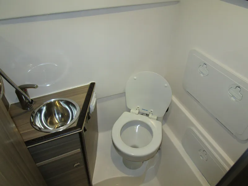 Slide: The Image of 2025 Solara S-310 CW boat interior with sleek white design and modern features. - 24