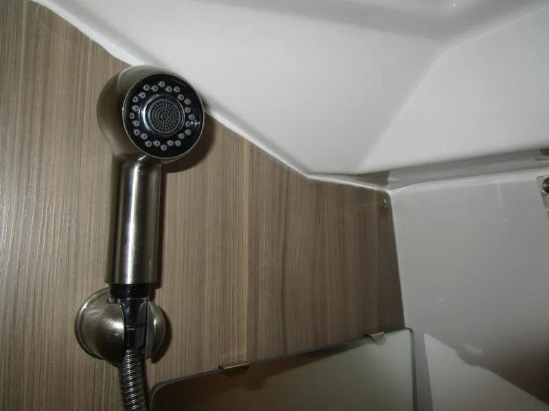 Slide: The Image of 2025 Solara S-310 CW boat interior with seating, table, and cup holders. - 25