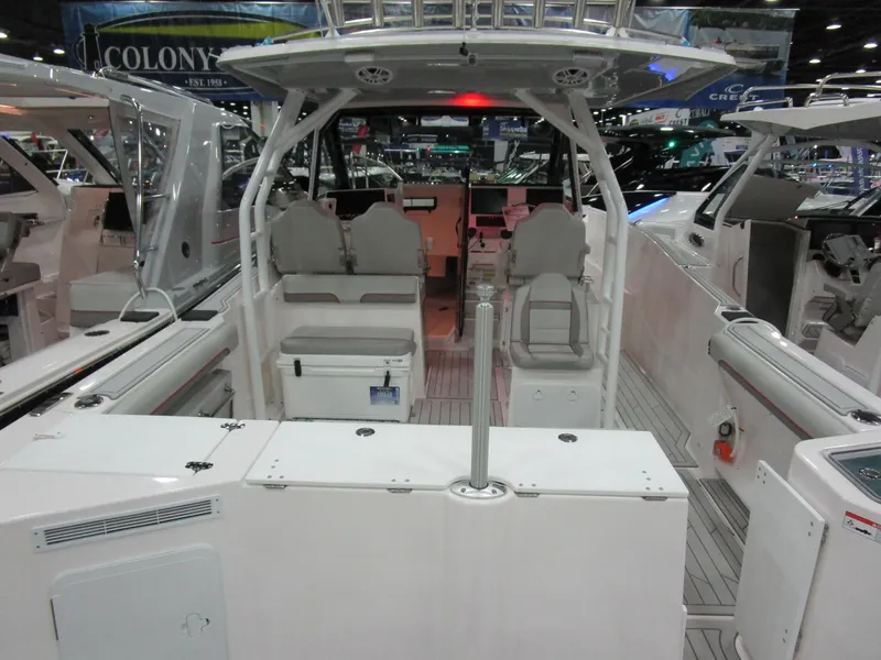Slide: The Image of 2025 Solara S-310 CW boat on trailer, sleek black hull, outdoor setting. - 3