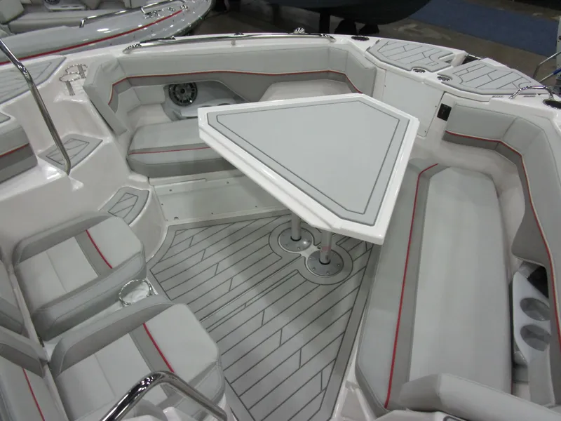 Slide: The Image of 2025 Solara S-310 CW boat interior with seating and table in showroom. - 30