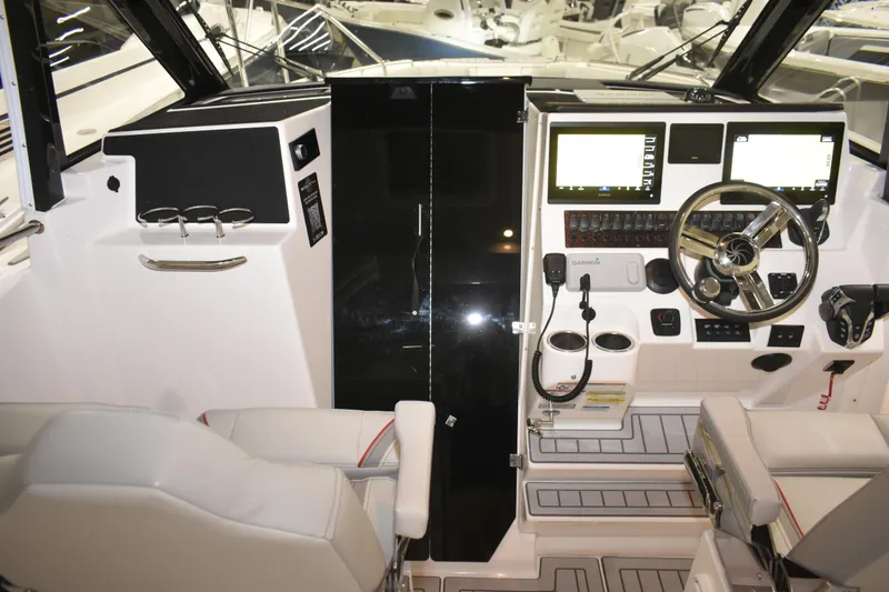 Slide: The Image of Interior of 2025 Solara S-310 CW boat, featuring sleek wooden door and modern design. - 36