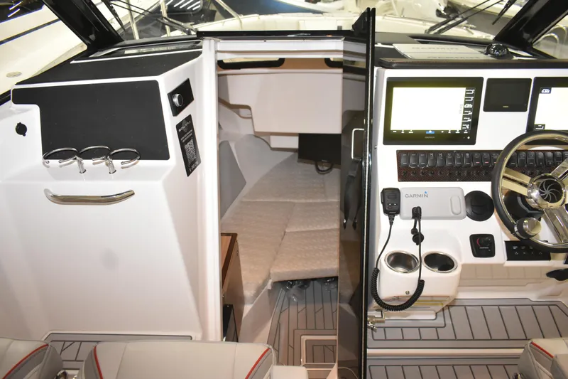 Slide: The Image of Compact bathroom in 2025 Solara S-310 CW boat with sink, toilet, and towel rack. - 37