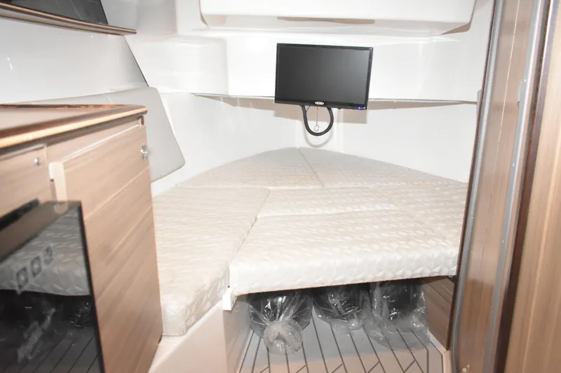 Slide: The Image of Compact bathroom in 2025 Solara S-310 CW boat with sink, toilet, and towel rack. - 38