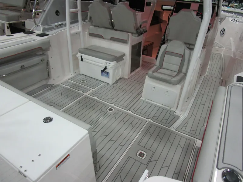 Slide: The Image of 2025 Solara S-310 CW boat on trailer, sleek design with black and red accents. - 5