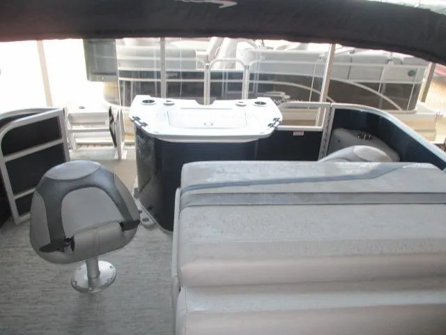 Slide: The Image of 2025 Bennington 23SXFAPG pontoon boat interior with seating and helm station. - 4