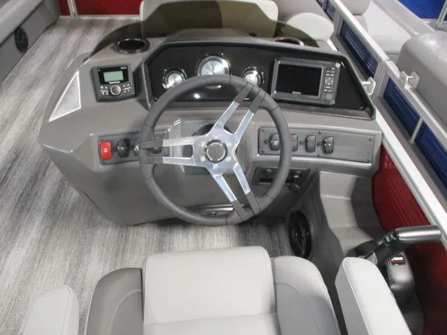 Slide: The Image of 2025 Bennington 20SL boat dashboard with steering wheel and control panel. - 3