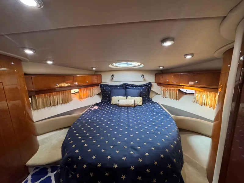 Slide: The Image of Luxurious cabin interior of 2008 Regal Commodore 4460 yacht with star-patterned bedding. - 11