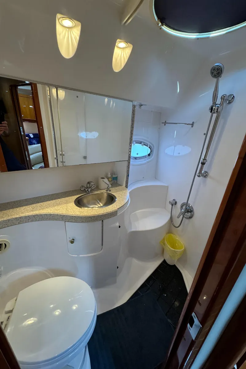 Slide: The Image of 2008 Regal Commodore 4460 yacht bathroom with modern fixtures and sleek design. - 15