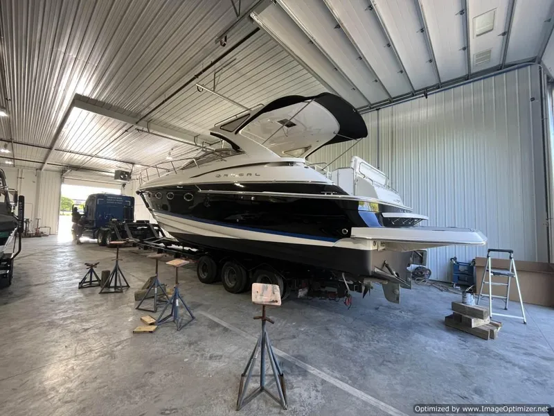 Slide: The Image of 2008 Regal Commodore 4460 yacht in a spacious indoor storage facility. - 24