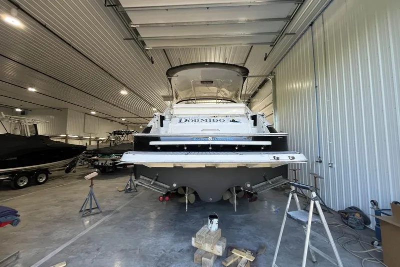 Slide: The Image of 2008 Regal Commodore 4460 yacht in storage, rear view, indoor facility. - 28