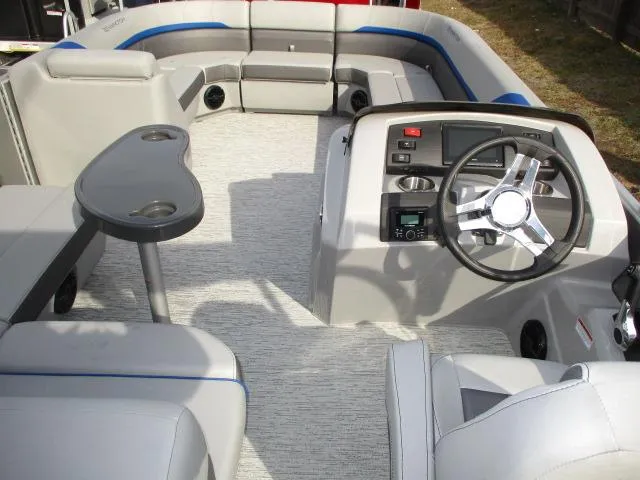 Slide: The Image of 2025 Bennington 23SXSAPG STERN FISH boat interior with steering console and seating area. - 2