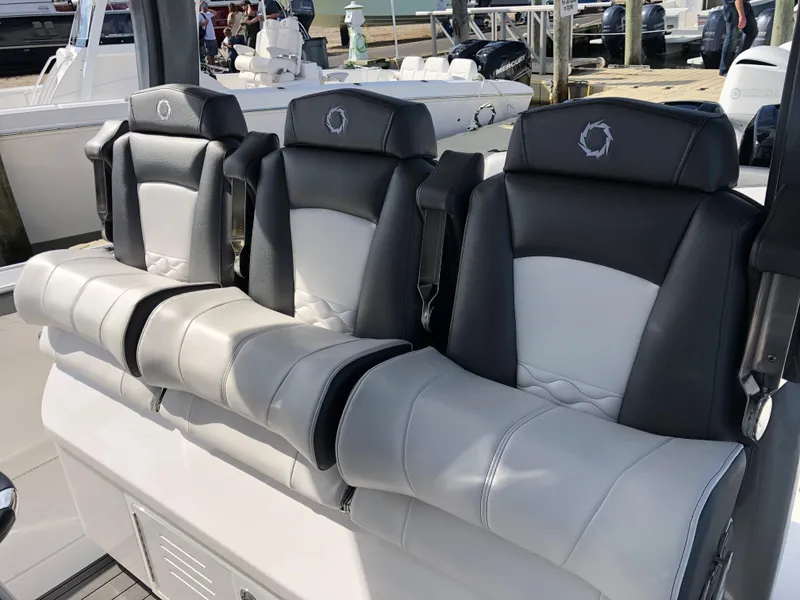 Slide: The Image of 2020 Fountain 43 NX boat seats, black and white leather, docked at marina. - 3