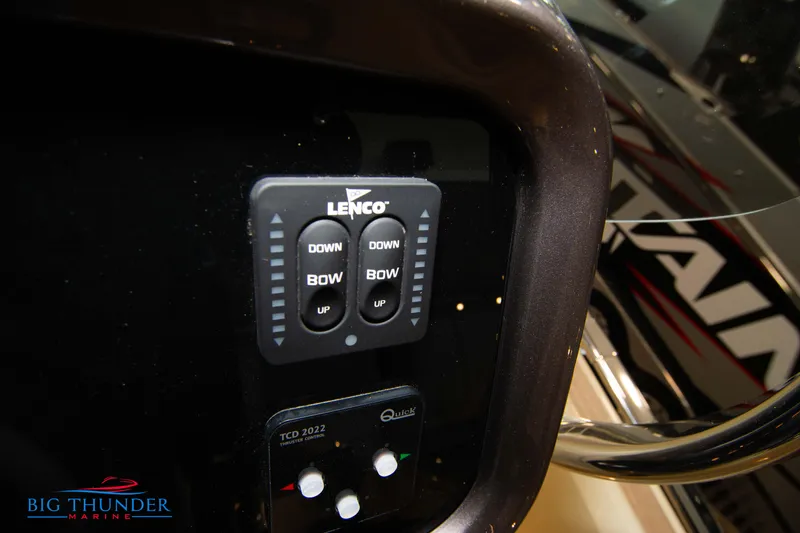 Slide: The Image of Control panel of 2024 Invictus GT320S boat with Lenco trim tab switches. - 24