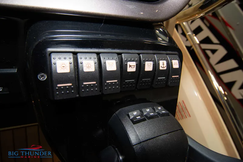 Slide: The Image of Control panel of 2024 Invictus GT320S boat with labeled switches. - 25