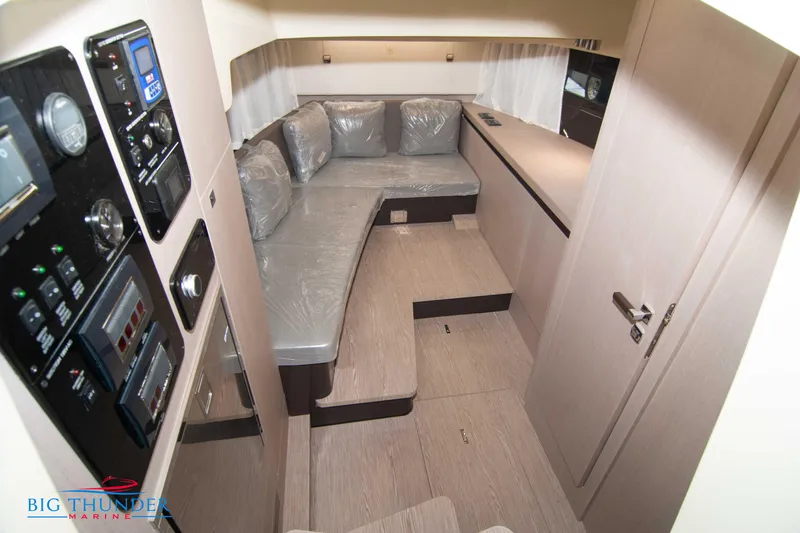 Slide: The Image of 2024 Invictus GT320S cabin interior with modern seating and control panels. - 42