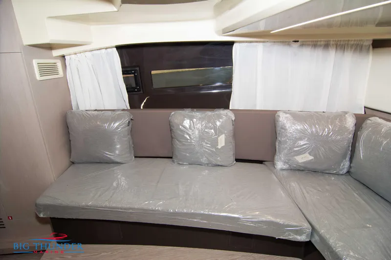 Slide: The Image of 2024 Invictus GT320S interior with gray seating and cushions, featuring modern design elements. - 45