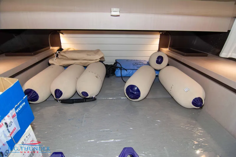 Slide: The Image of 2024 Invictus GT320S storage area with boat fenders and equipment. - 47