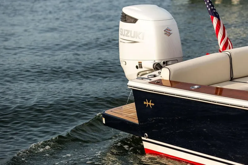 Slide: The Image of 2021 Hunt Yachts Harrier 26 with Suzuki outboard motor on calm water. - 16