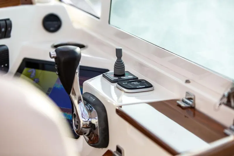 Slide: The Image of Control panel of 2021 Hunt Yachts Harrier 26, featuring joystick and throttle. - 22