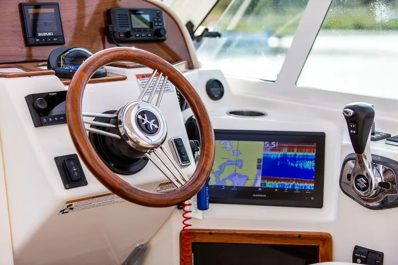 Slide: The Image of 2021 Hunt Yachts Harrier 26 helm with Garmin display and Suzuki controls. - 23