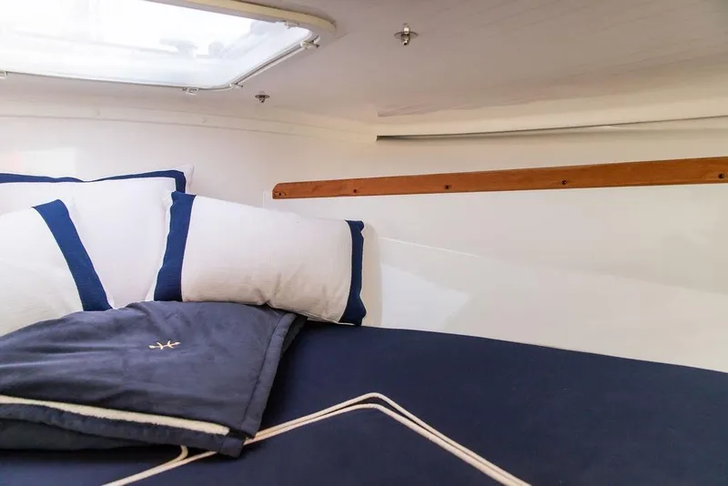 Slide: The Image of Cozy cabin interior of 2021 Hunt Yachts Harrier 26 with plush bedding. - 27