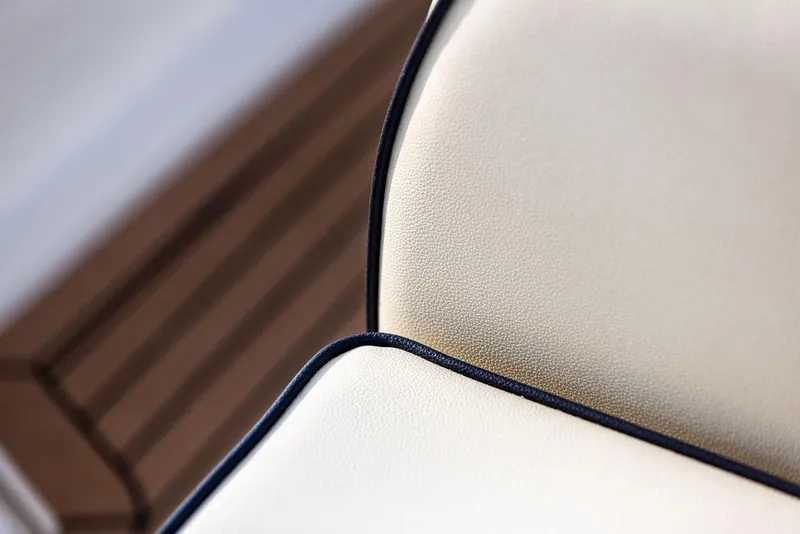 Slide: The Image of Close-up of 2021 Hunt Yachts Harrier 26 beige leather seat with dark trim. - 30