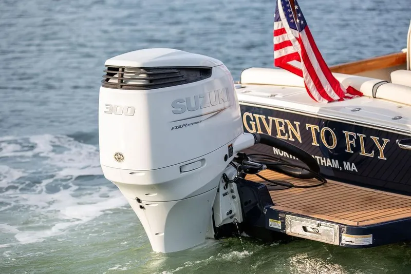 Slide: The Image of 2021 Hunt Yachts Harrier 26 with Suzuki 300 engine, American flag, "Given to Fly" text. - 41