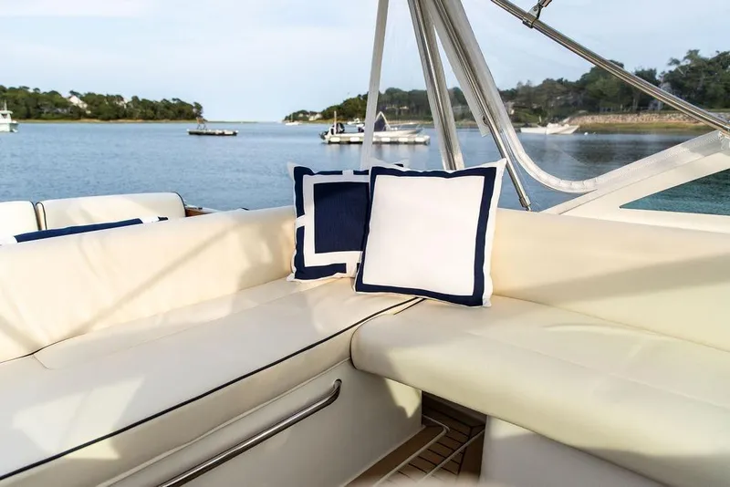 Slide: The Image of Luxurious seating on 2021 Hunt Yachts Harrier 26, featuring elegant cushions and scenic water view. - 42