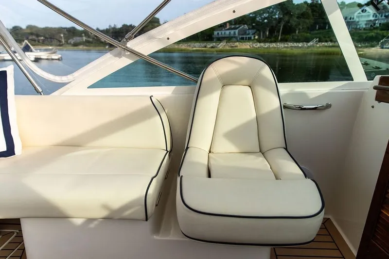 Slide: The Image of Luxury seating on 2021 Hunt Yachts Harrier 26, featuring elegant cream upholstery. - 43