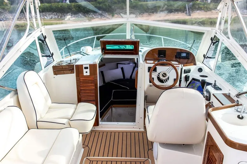 Slide: The Image of 2021 Hunt Yachts Harrier 26 interior with elegant seating and modern helm controls. - 45