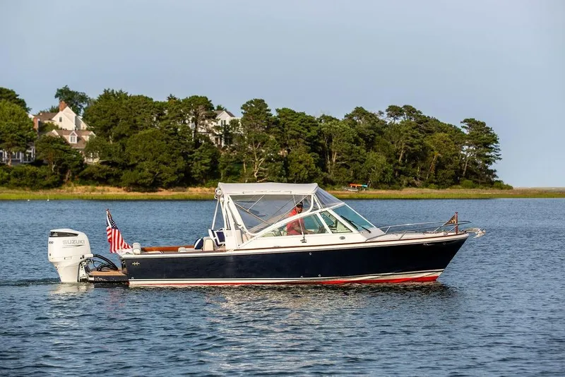 Slide: The Image of 2021 Hunt Yachts Harrier 26 on calm water with scenic background. - 47