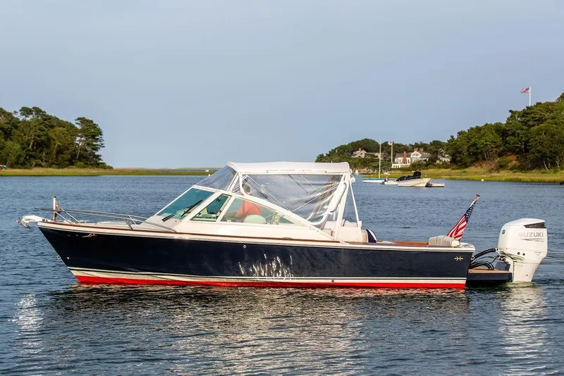 Slide: The Image of 2021 Hunt Yachts Harrier 26 boat on calm water with scenic background. - 54