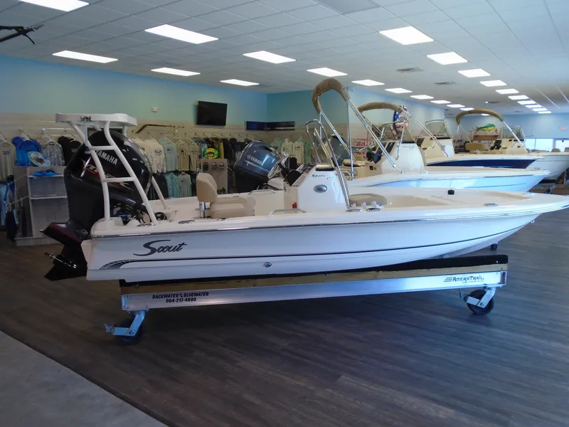 Slide: The Image of 2025 Scout 177 Sport boat displayed in a showroom. - 2