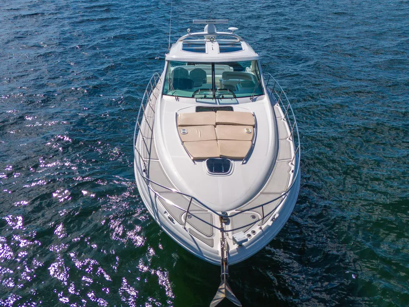 Slide: The Image of 2010 Sea Ray 500 Sundancer yacht on open water, aerial view. - 16