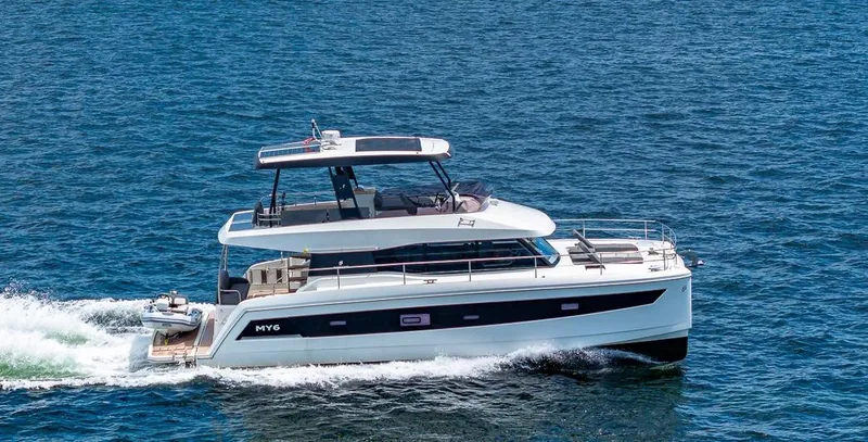 Slide: The Image of 2022 Fountaine Pajot MY6 yacht cruising on open water. - 2