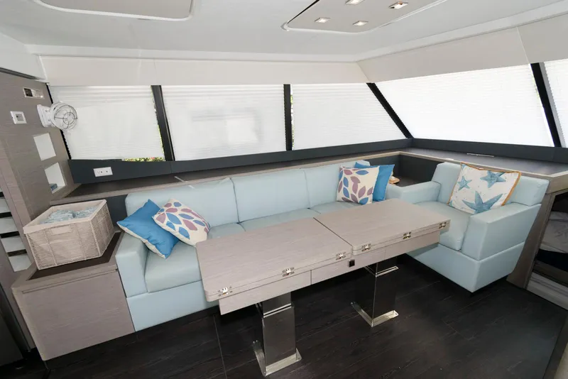Slide: The Image of Modern interior of 2022 Fountaine Pajot MY6 yacht with stylish seating and table. - 30