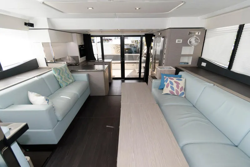 Slide: The Image of Luxurious interior of 2022 Fountaine Pajot MY6 yacht with modern seating and decor. - 31