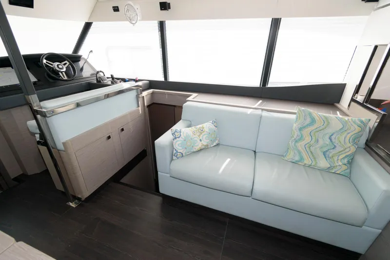 Slide: The Image of Interior of 2022 Fountaine Pajot MY6 yacht with modern seating and helm station. - 32