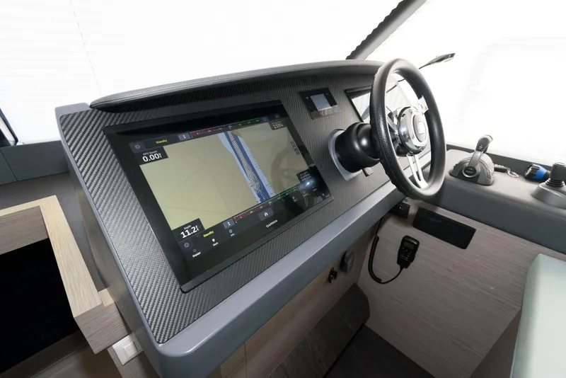 Slide: The Image of 2022 Fountaine Pajot MY6 helm with navigation display and steering wheel. - 34