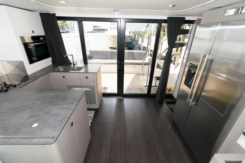 Slide: The Image of Modern kitchen interior of 2022 Fountaine Pajot MY6 yacht with sleek design and large windows. - 35