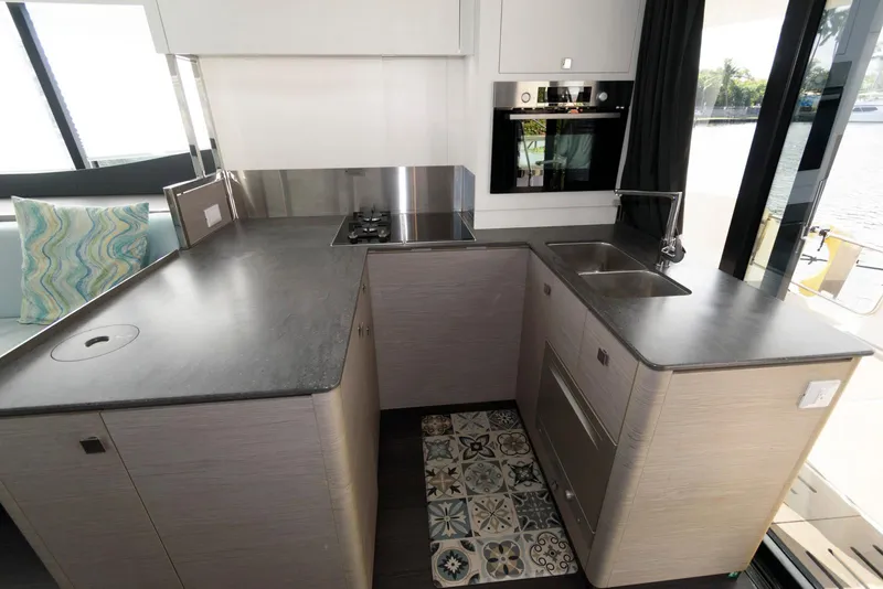 Slide: The Image of Modern kitchen in 2022 Fountaine Pajot MY6 yacht with sleek countertops and stylish appliances. - 36