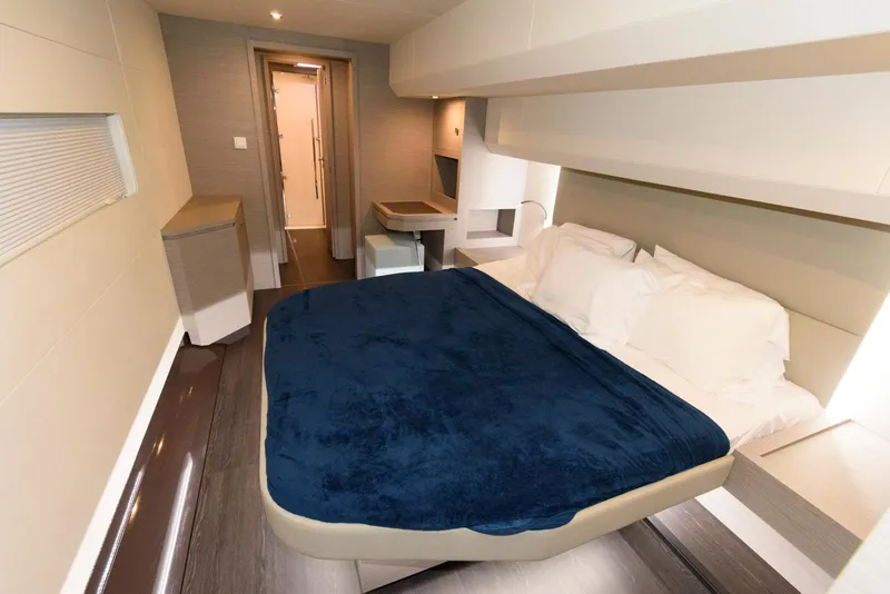 Slide: The Image of Luxurious bedroom interior of 2022 Fountaine Pajot MY6 yacht with modern design and cozy bedding. - 38