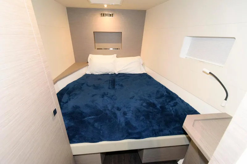 Slide: The Image of 2022 Fountaine Pajot MY6 cabin with cozy bed and modern interior design. - 45